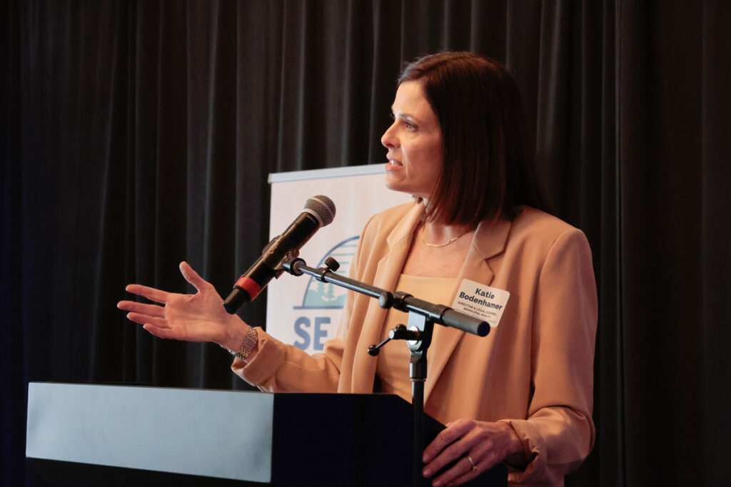 Municipal Health Director and Legal Counsel Katie Bodenhamer stands behind the podium while speaking to attendees.