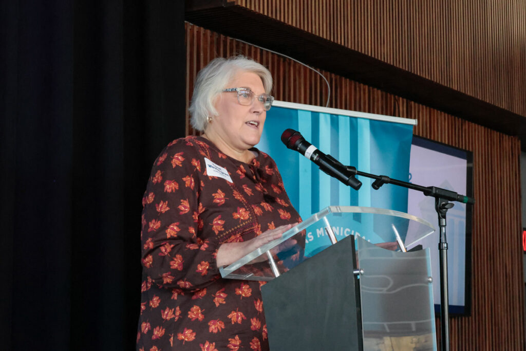 Beebe clerk/treasurer Carol Westergren speaks from the podium at a regional meeting.